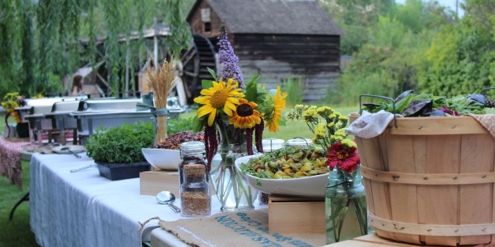 A buffet set out in front of our 1877 waterwheel-powered flour mill.